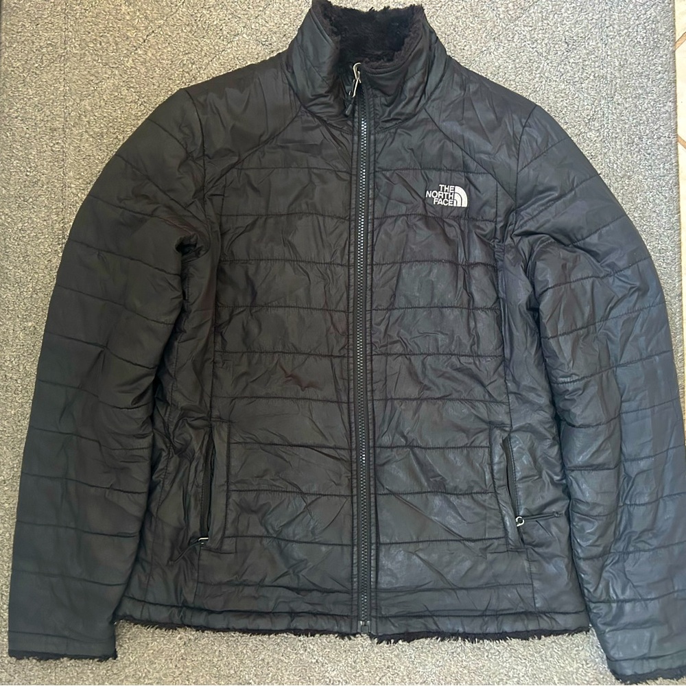 The North Face black reversible puffer jacket; women’s size small